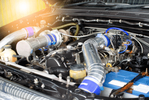 Close-up of a car engine showing the intricate components and parts working together to power the vehicle