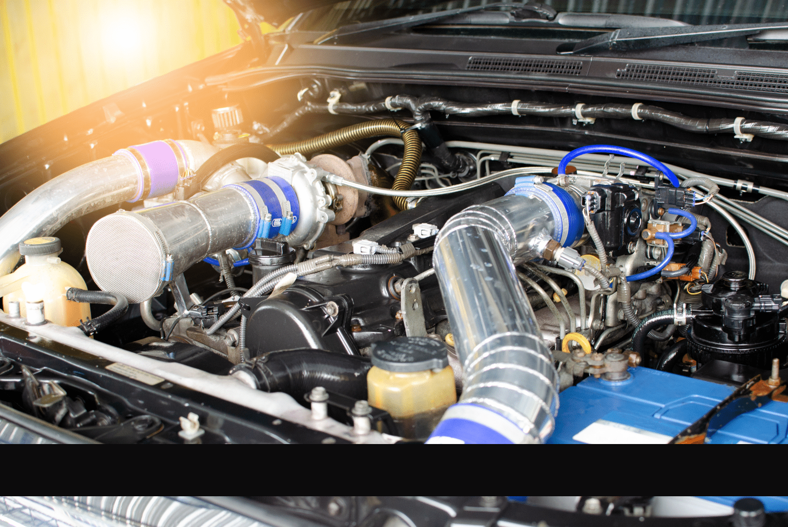 Close-up of a car engine showing the intricate components and parts working together to power the vehicle