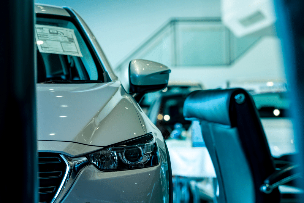 Front View of Compact Cars in a Contemporary Car Dealership